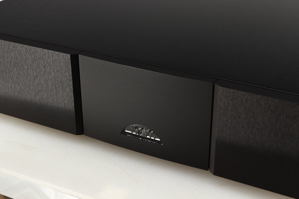 Close up of a used Naim CD555PS DR Power Supply in a black finish showing logo
