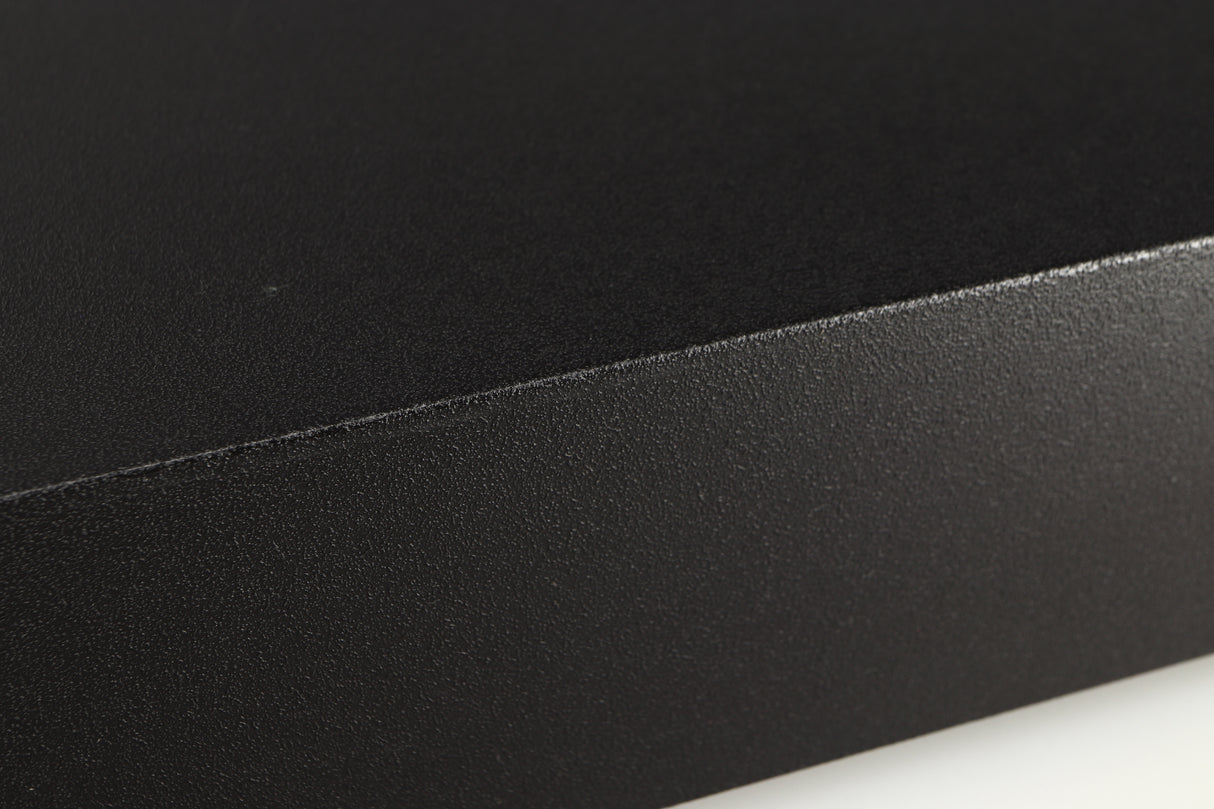 Close up of a used Naim Hicap Power Supply in a black finish showing mark on left side edge
