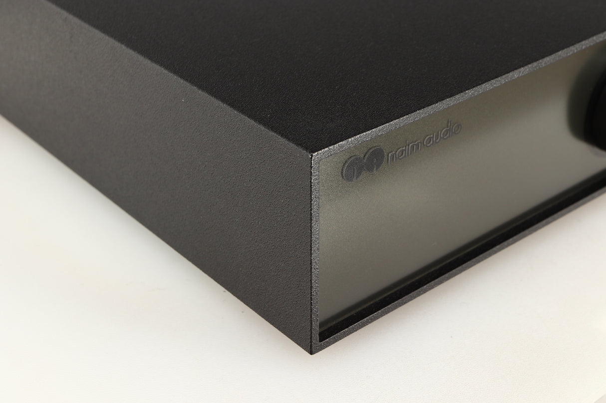 Front left corner of a used Naim Hicap Power Supply in a black finish