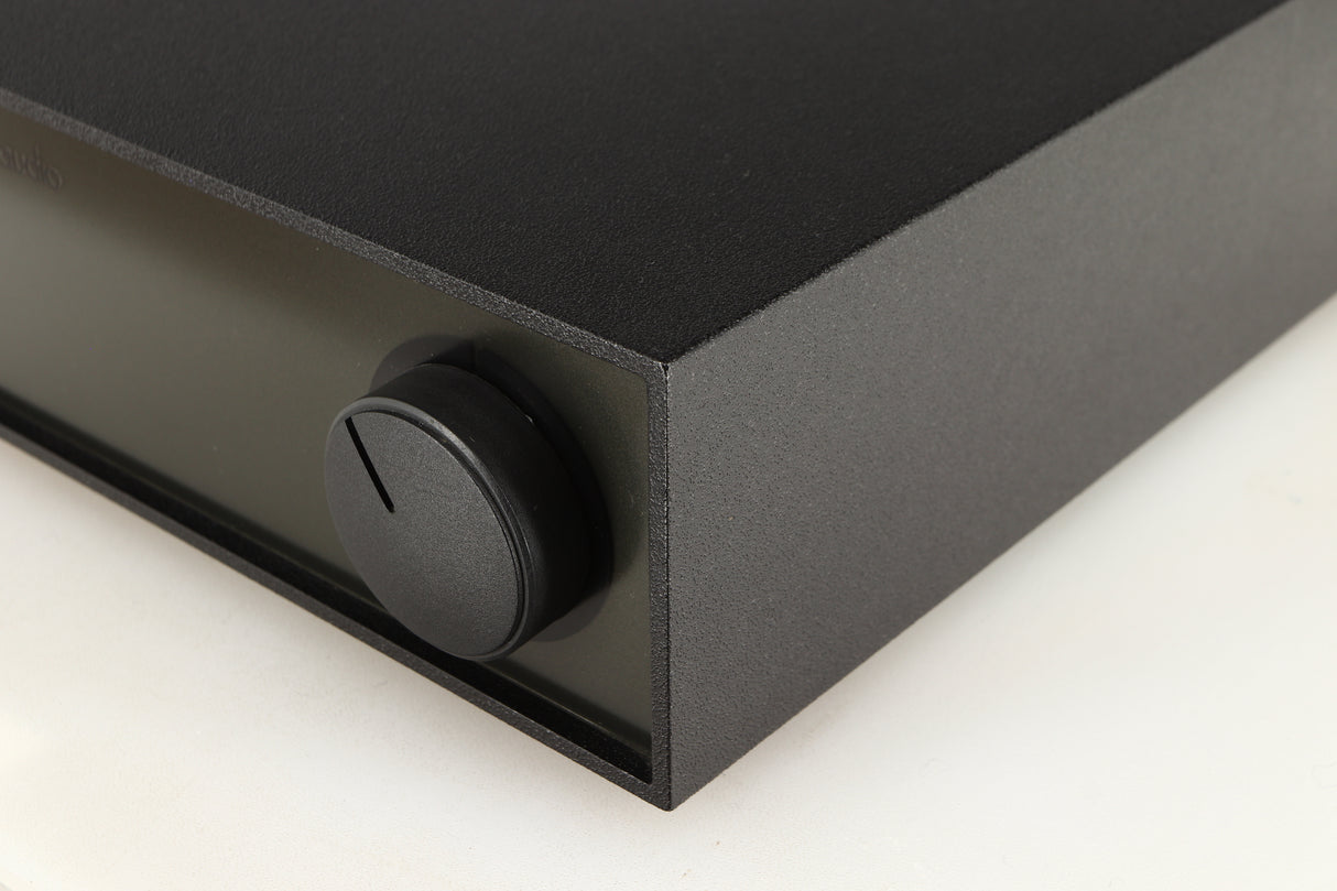 Front right corner of a used Naim Hicap Power Supply in a black finish