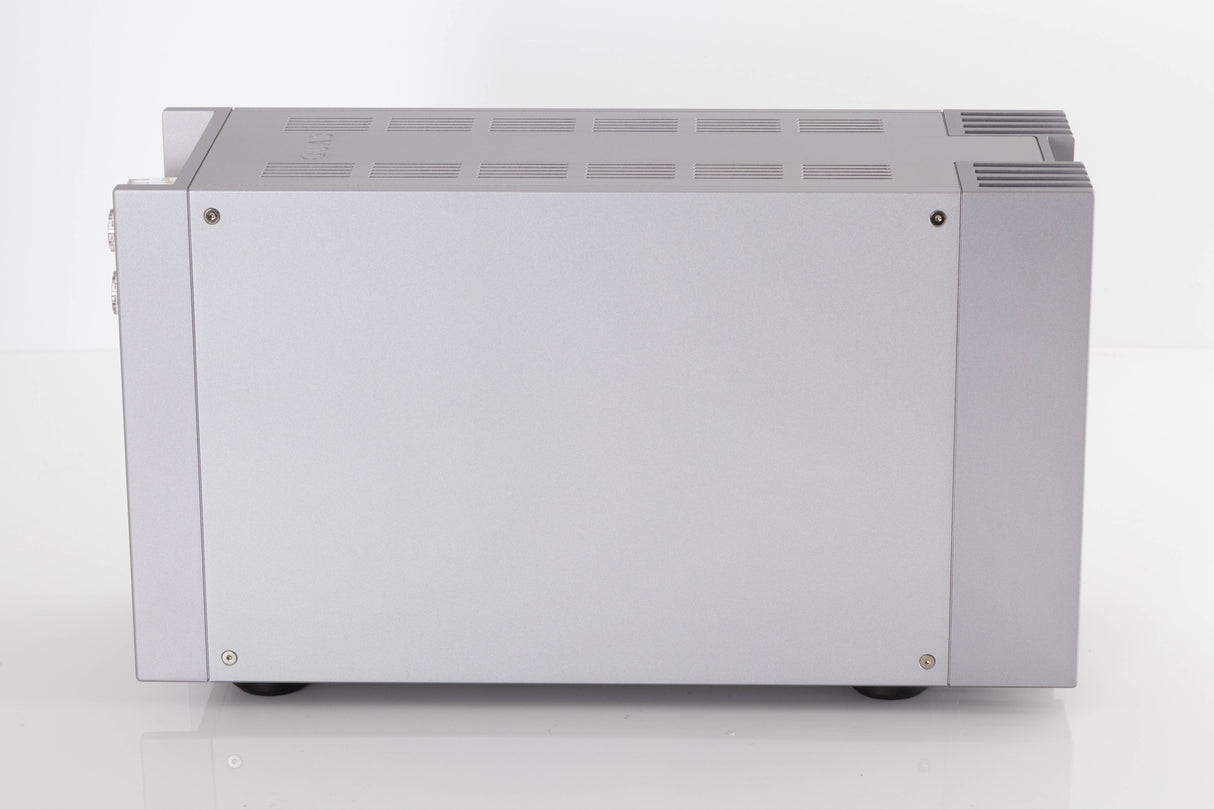 Left side view of a used Quad 303 Power Amplifier in a Silver finish
