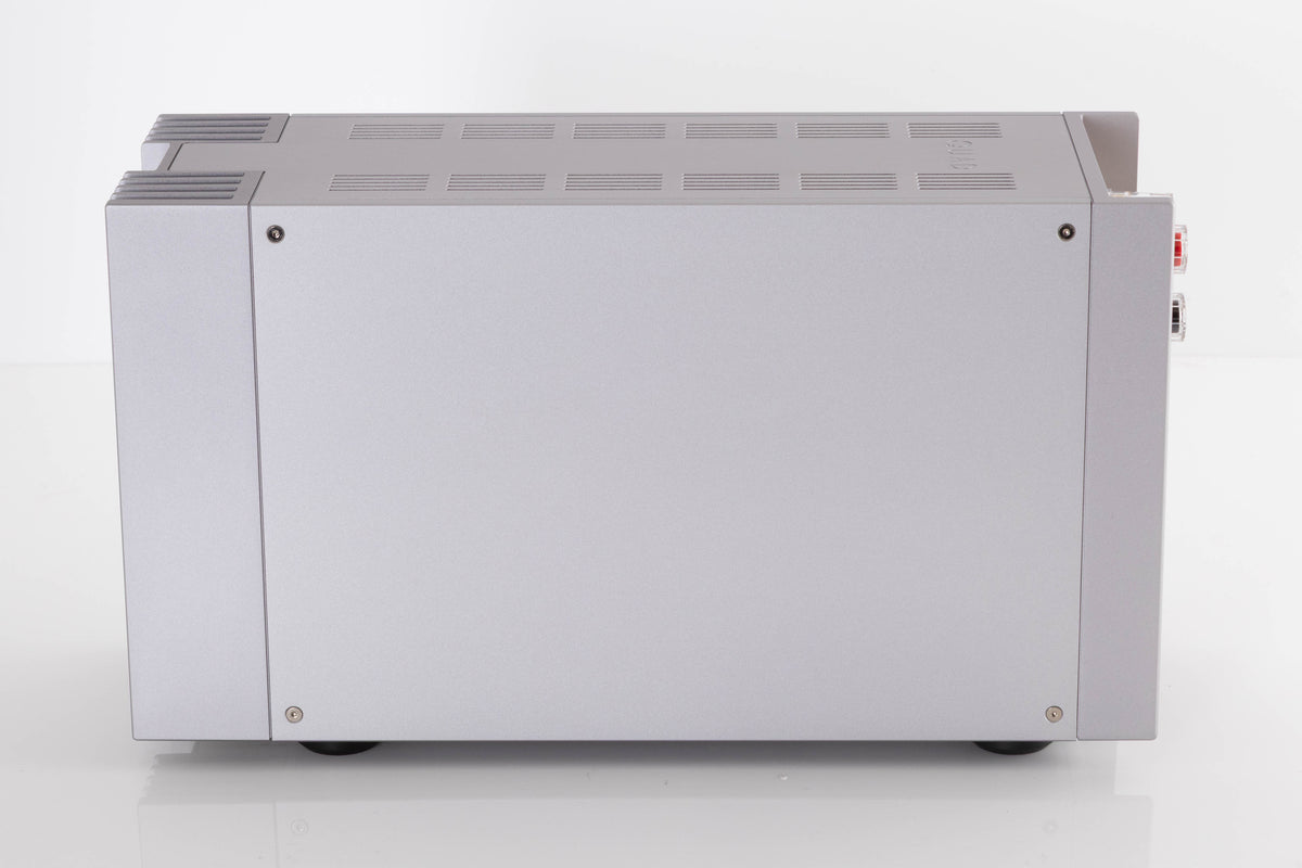 Right side view of a used Quad 303 Power Amplifier in a Silver finish