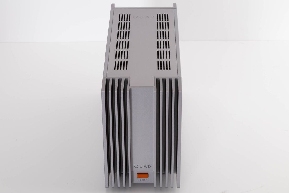 Top of a used Quad 303 Power Amplifier in a Silver finish