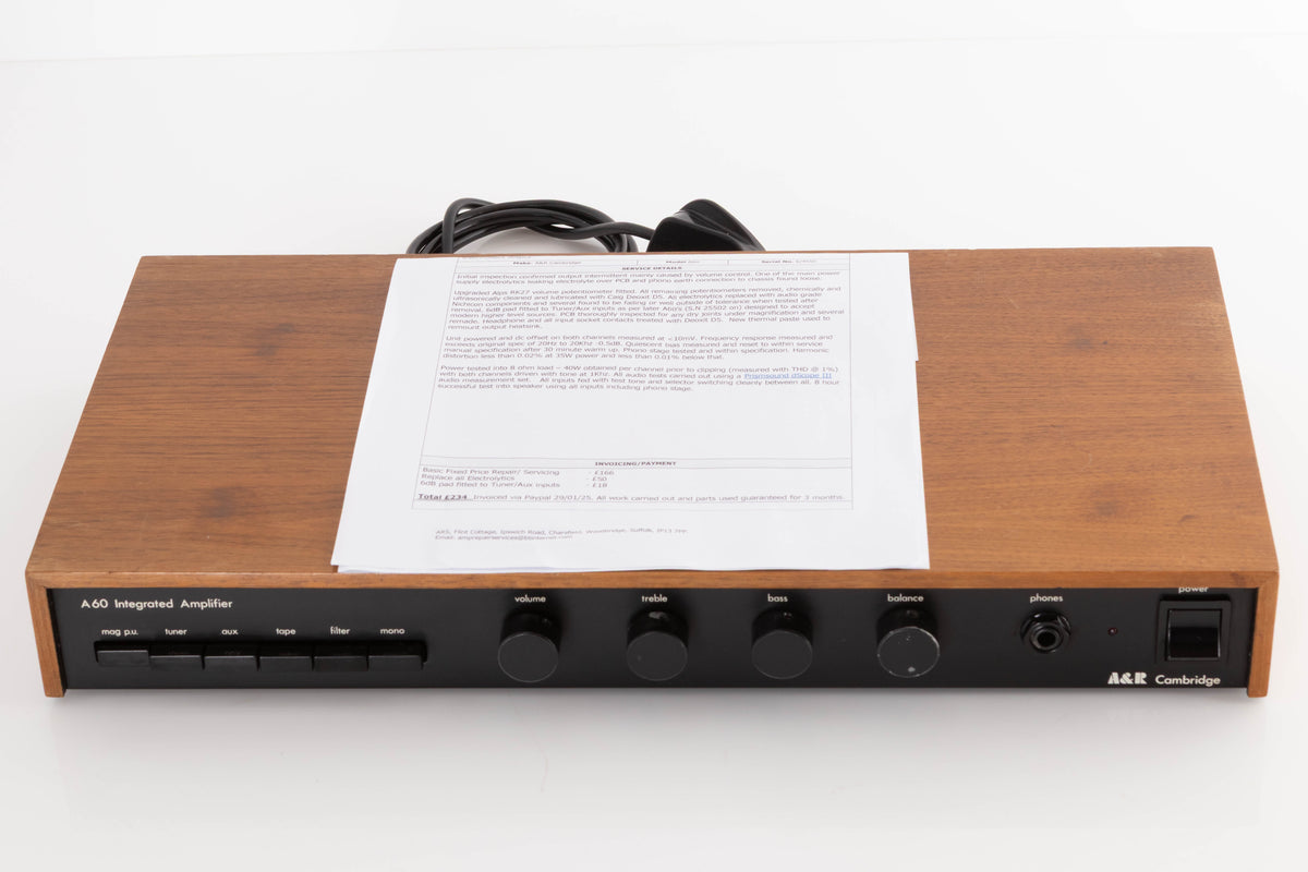 Top of a used A&R A60 Integrated Amplifier in a Teak finish showing Service Sheet