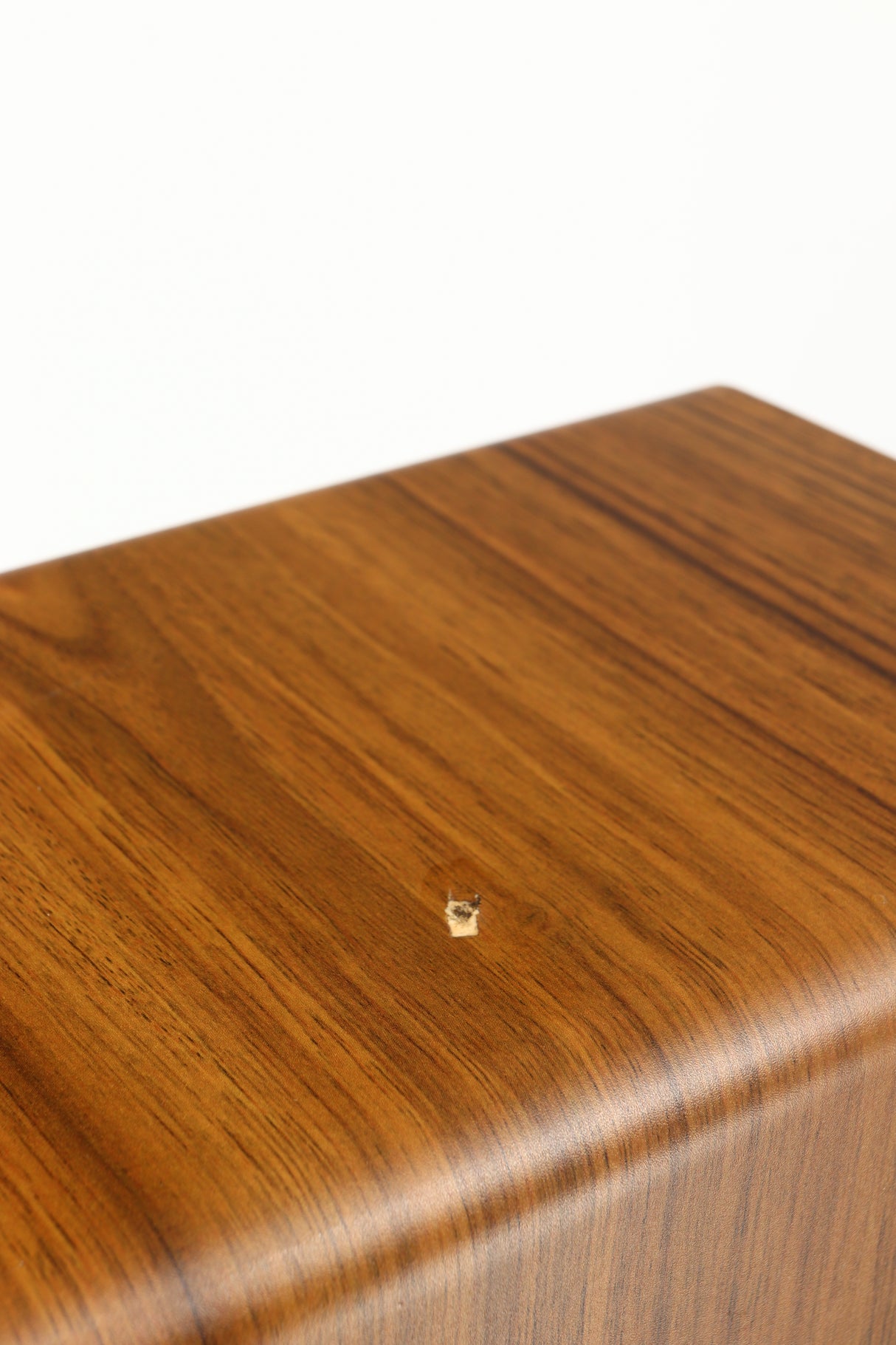 Close up of a used Acoustic Energy AE109 Series Floorstanding Speaker in a walnut finish showing some damage