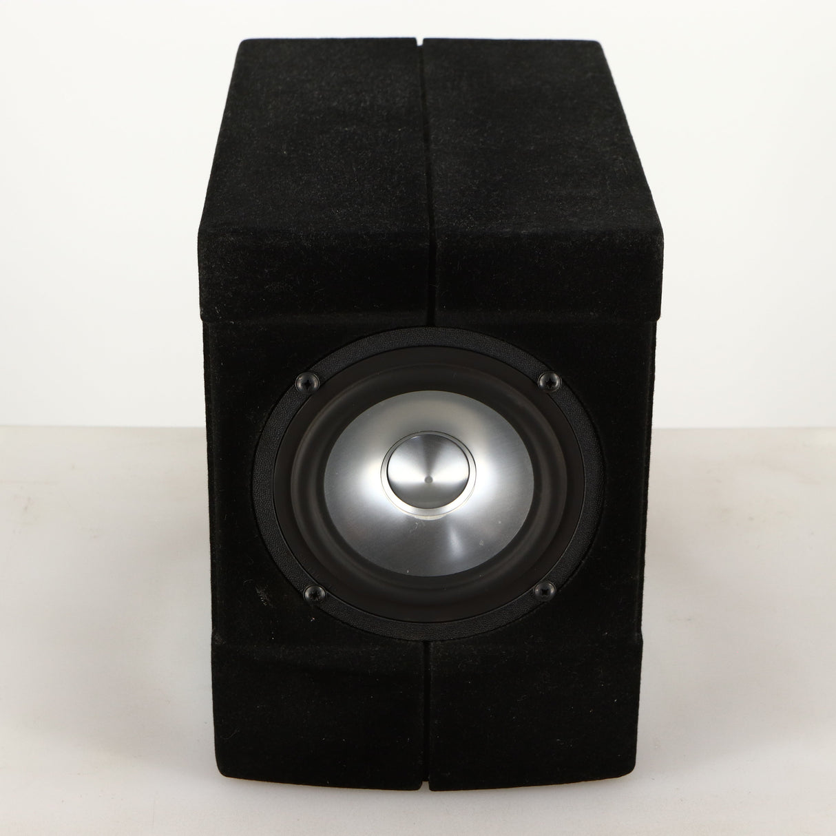 Top of a used Acoustic Precision Eikos FR1 Standmount Speaker in a black flock finish
