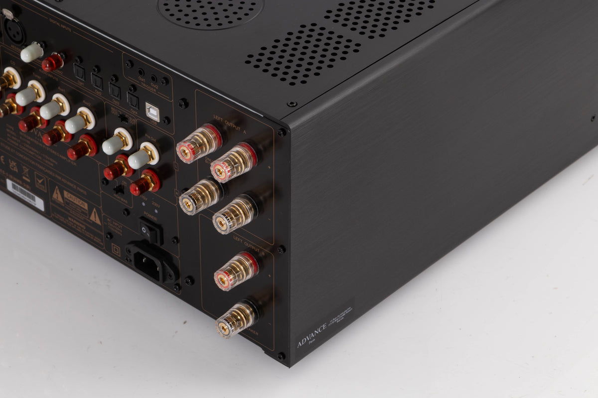Rear left corner of a used Advanced Paris X-i1100 Integrated Amplifier in a Black finish