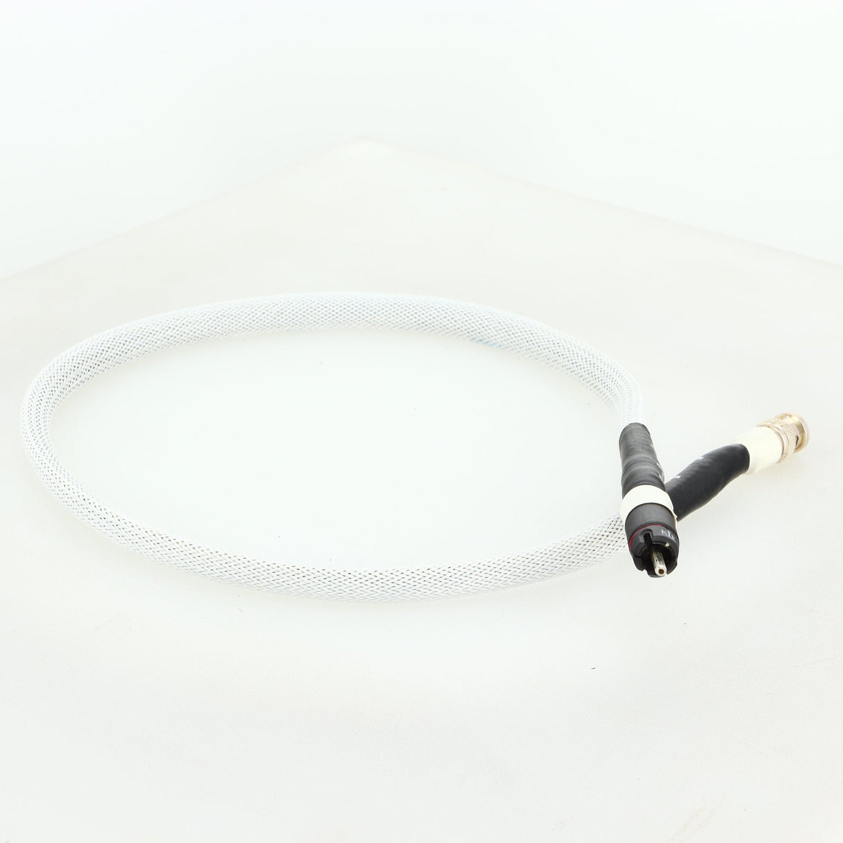 Front left corner of a used AF Audio Silver Digital Interconnect Cable RCA-BNC 0.75m in a white finish