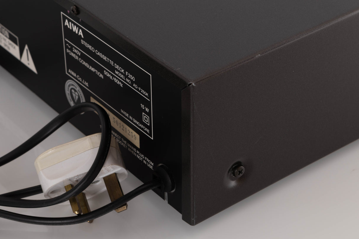Rear left corner of a used Aiwa F250 Cassette Deck