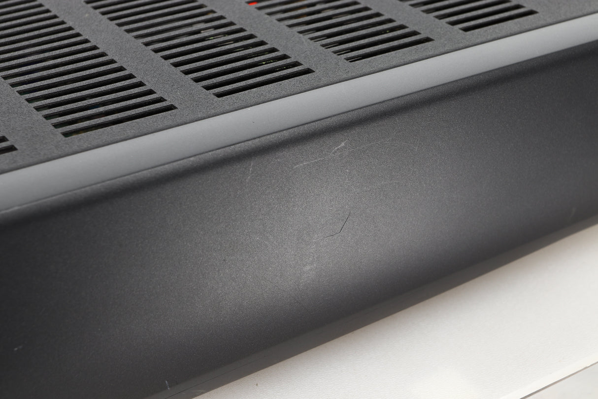 Close up view of a used Arcam Alpha 10 Power Amplifier showing scratching on the fascia
