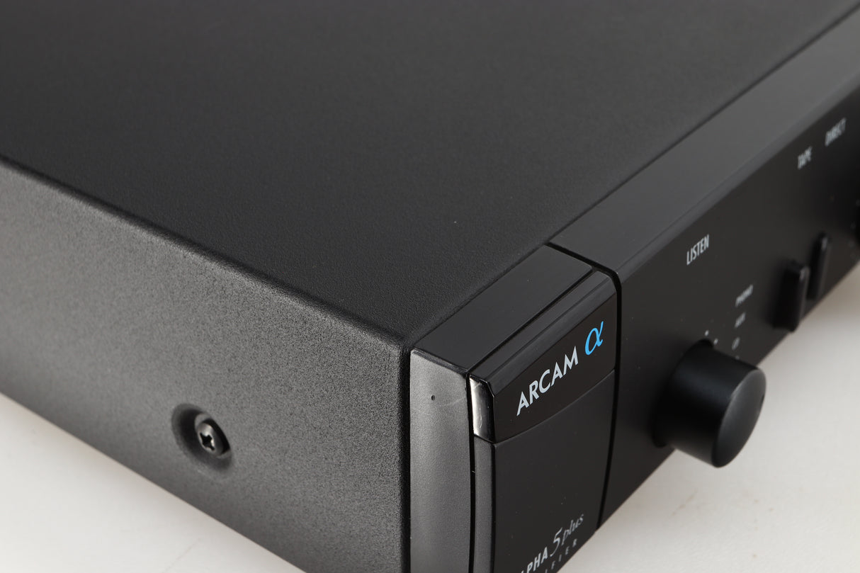 Close up of a used Arcam Alpha 5 Plus Integrated Amplifier in a black finish showing scratch on front left corner
