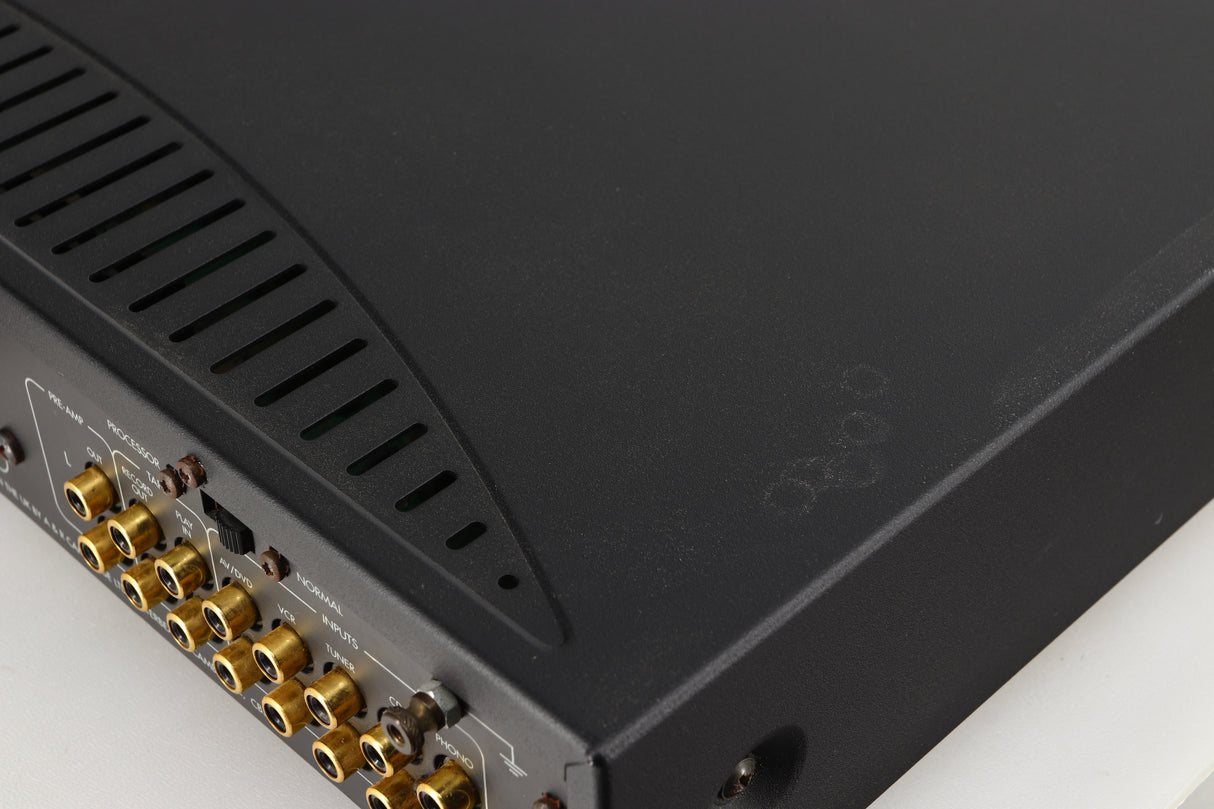 Close up of a used Arcam Alpha 8R Integrated Amplifier in a black finish showing marks on top