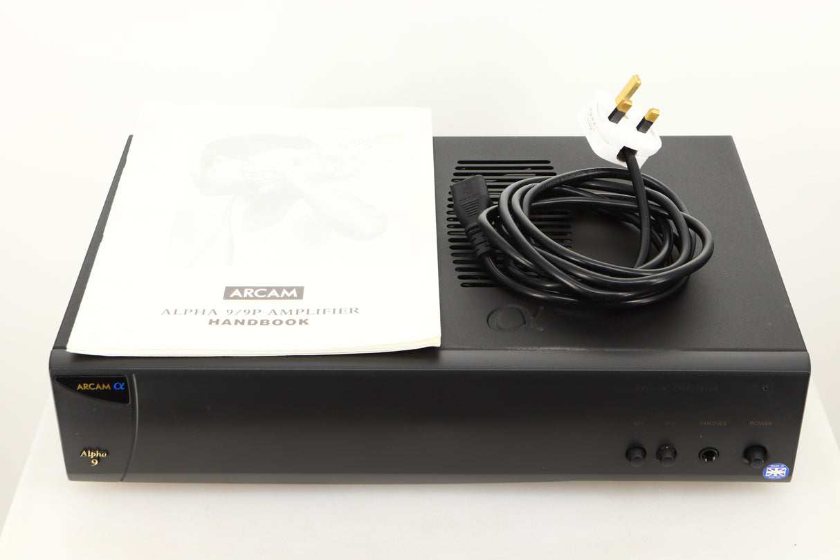 View of a used Arcam Alpha 9 Power Amplifier showing mains cable, and manual