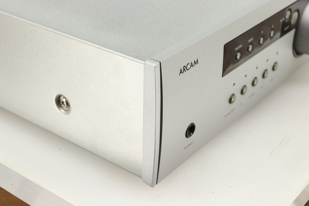 Front left corner of a used Arcam Diva A85 Integrated Amplifier in a silver finish