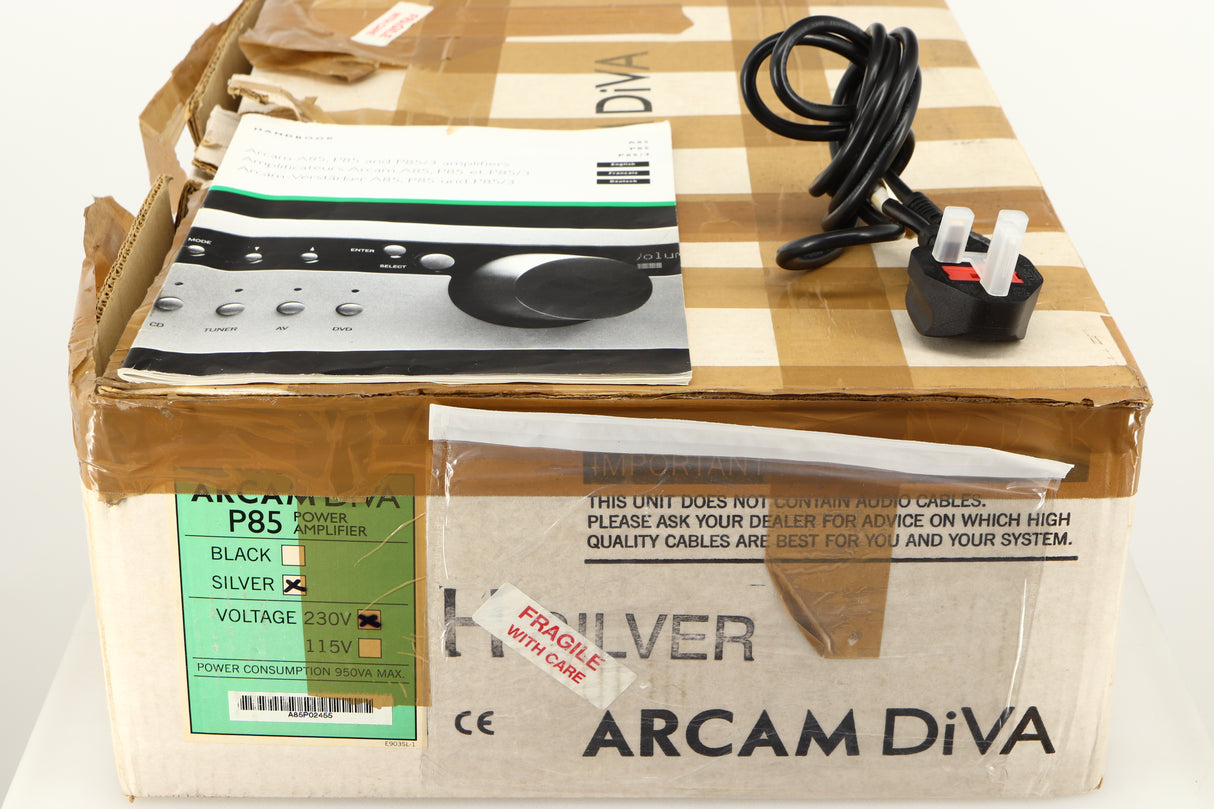 Box for a used Arcam P85/3 Power Amplifier in a silver finish showing Manual and Mains Cable
