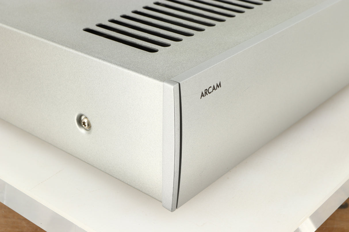 Front left corner of a used Arcam P85/3 Power Amplifier in a silver finish