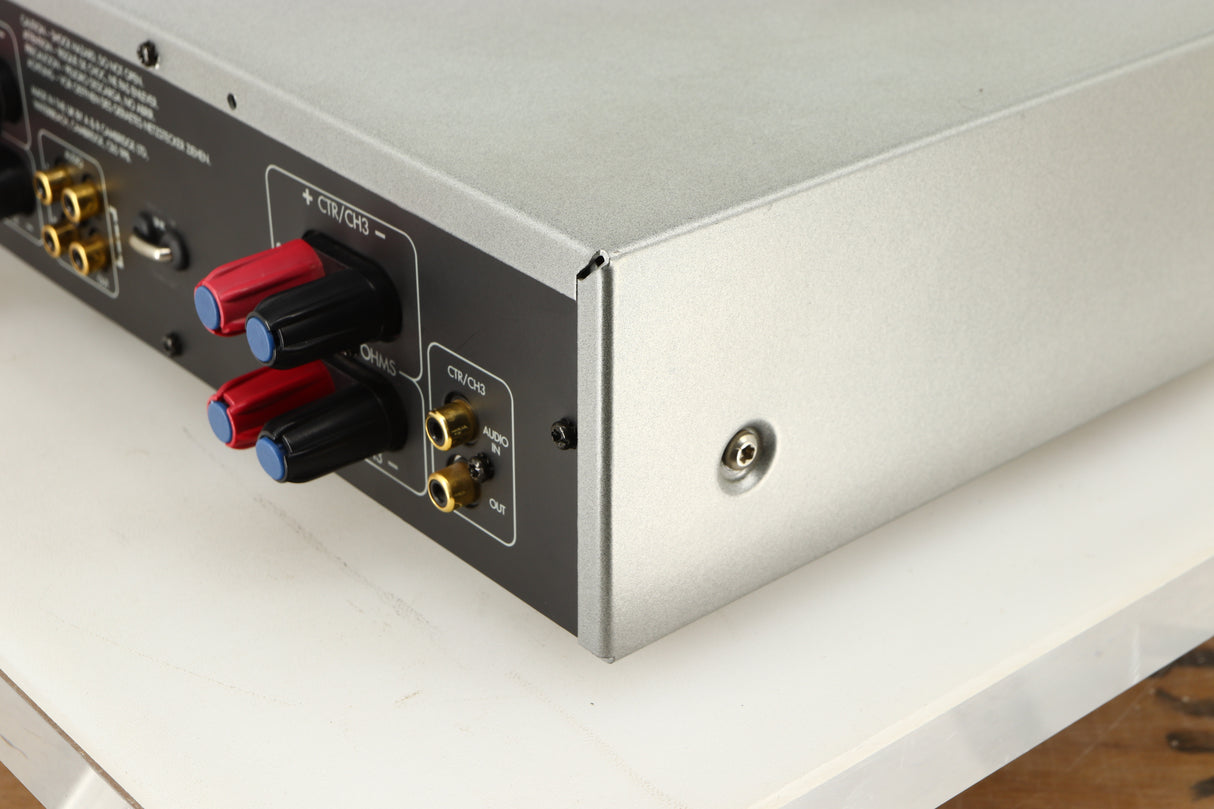Rear left corner of a used Arcam P85/3 Power Amplifier in a silver finish