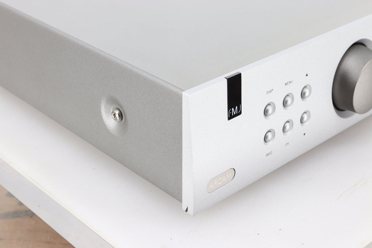 Front left corner of a used Arcam FMJ T32 FM / DAB Tuner in a silver finish