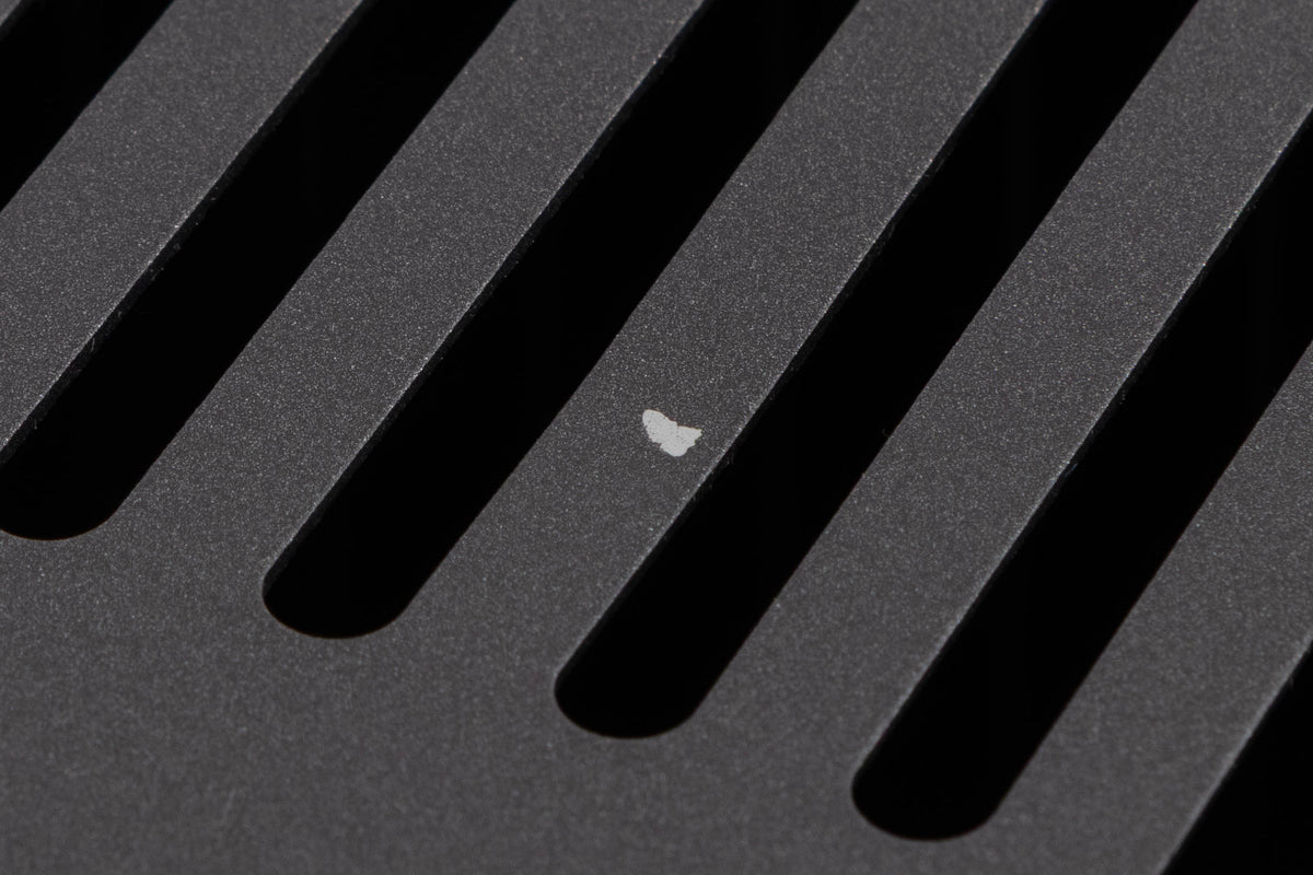Close up of a used Arcam P349 Power Amplifier in a Black finish showing small chip on top