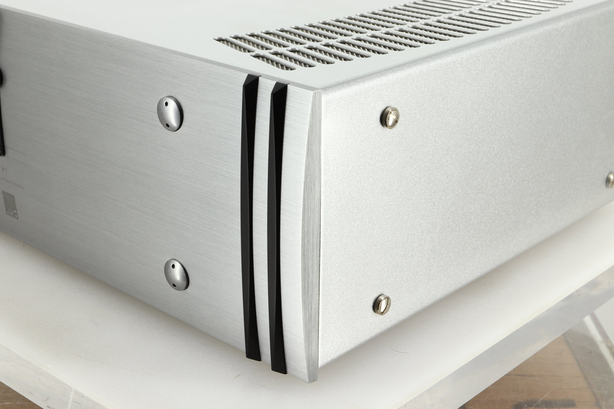 Front right corner view of a used ATC P1 Power Amplifier in silver finish