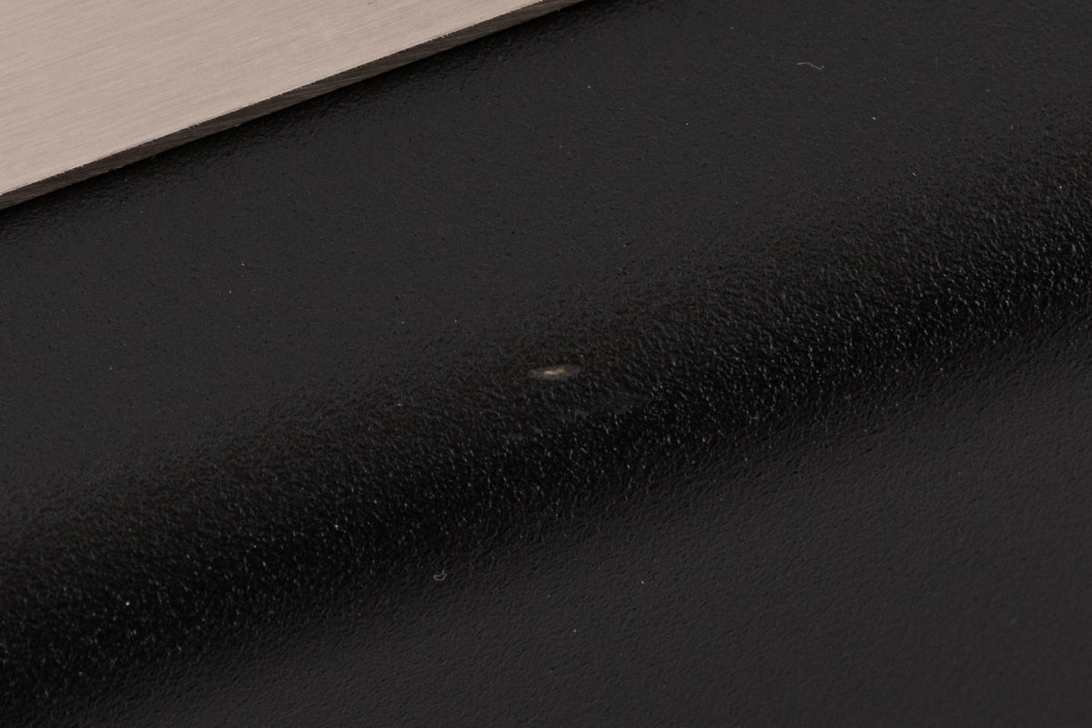 Close up of a used Atlas EOS Modular 4-Way Mains Block in a Black finish showing tiny scratch