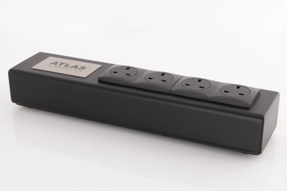 Front right corner of a used Atlas EOS Modular 4-Way Mains Block in a Black finish