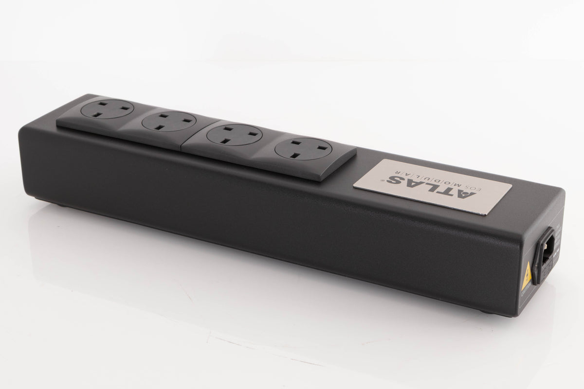 Rear left corner of a used Atlas EOS Modular 4-Way Mains Block in a Black finish