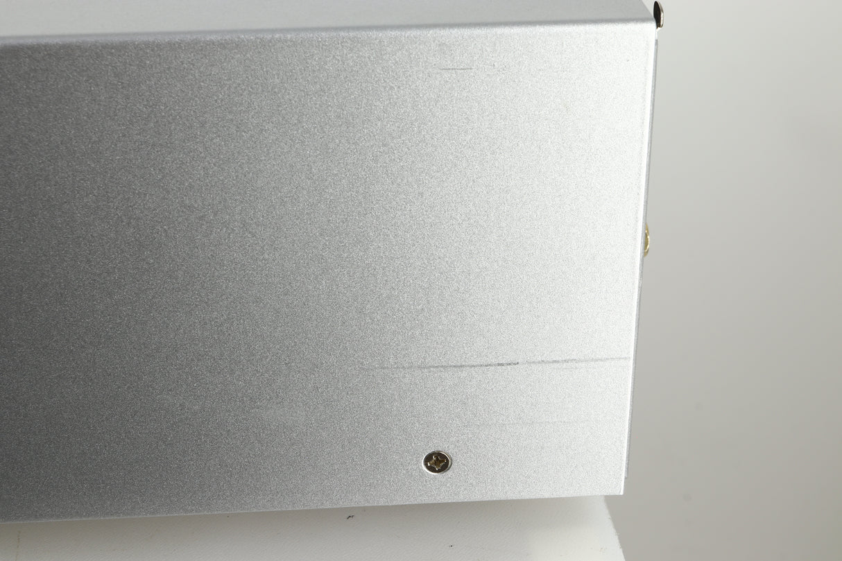 Close up view of a used Audio Research DSi200 Integrated Amplifier in silver finish showing a scratch on the right side near the back
