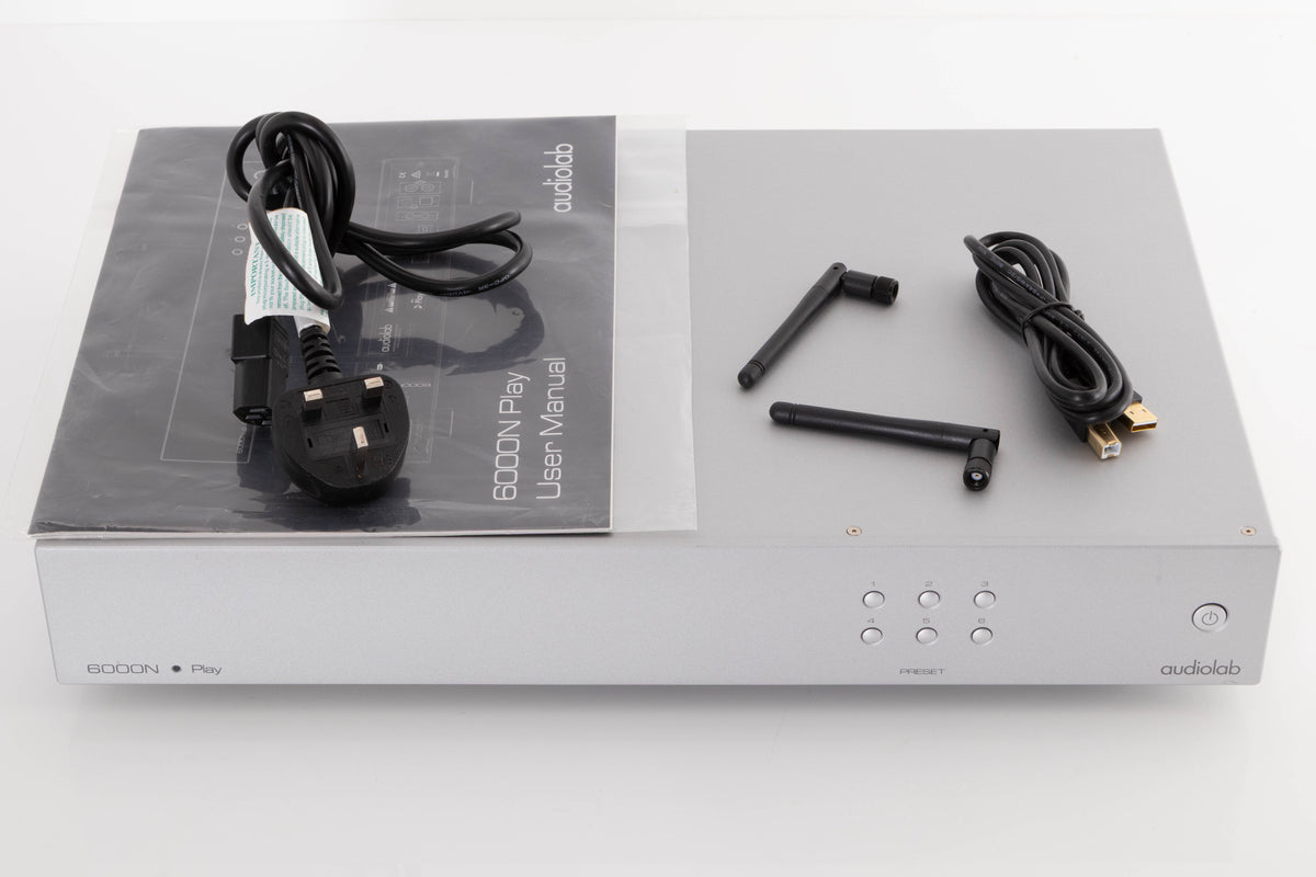 Top of a used Audiolab 6000N Play Network Streamer in a Silver finish showing Mains Cable, USB Cable, Manual and W-Fi Aerials