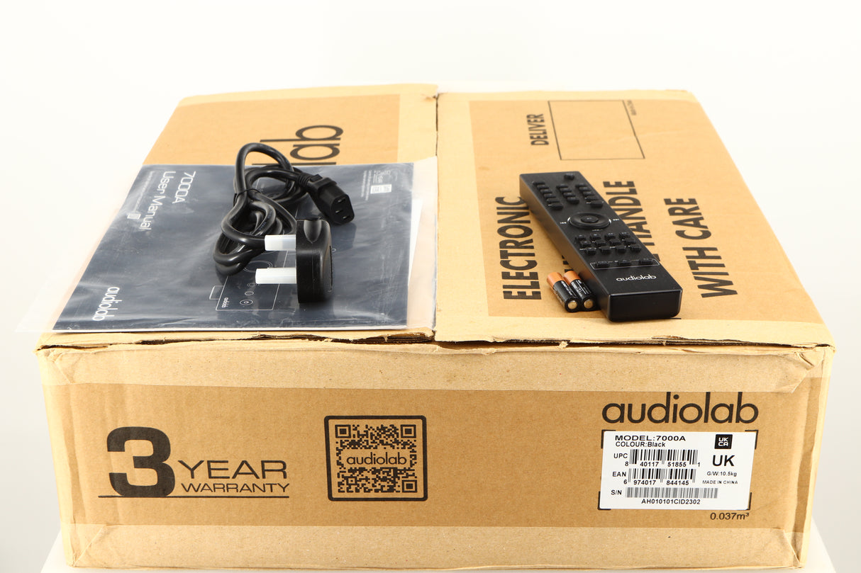 Box for a used Audiolab 7000A Integrated Amplifier in a black finish showing Remote, 2x Batteries, Manual and Mains Cable