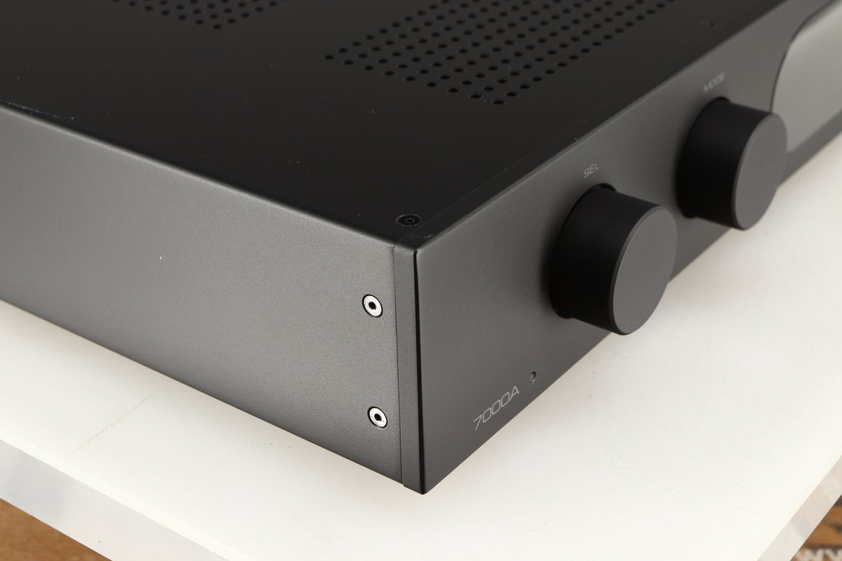 Front left corner of a used Audiolab 7000A Integrated Amplifier in a black finish