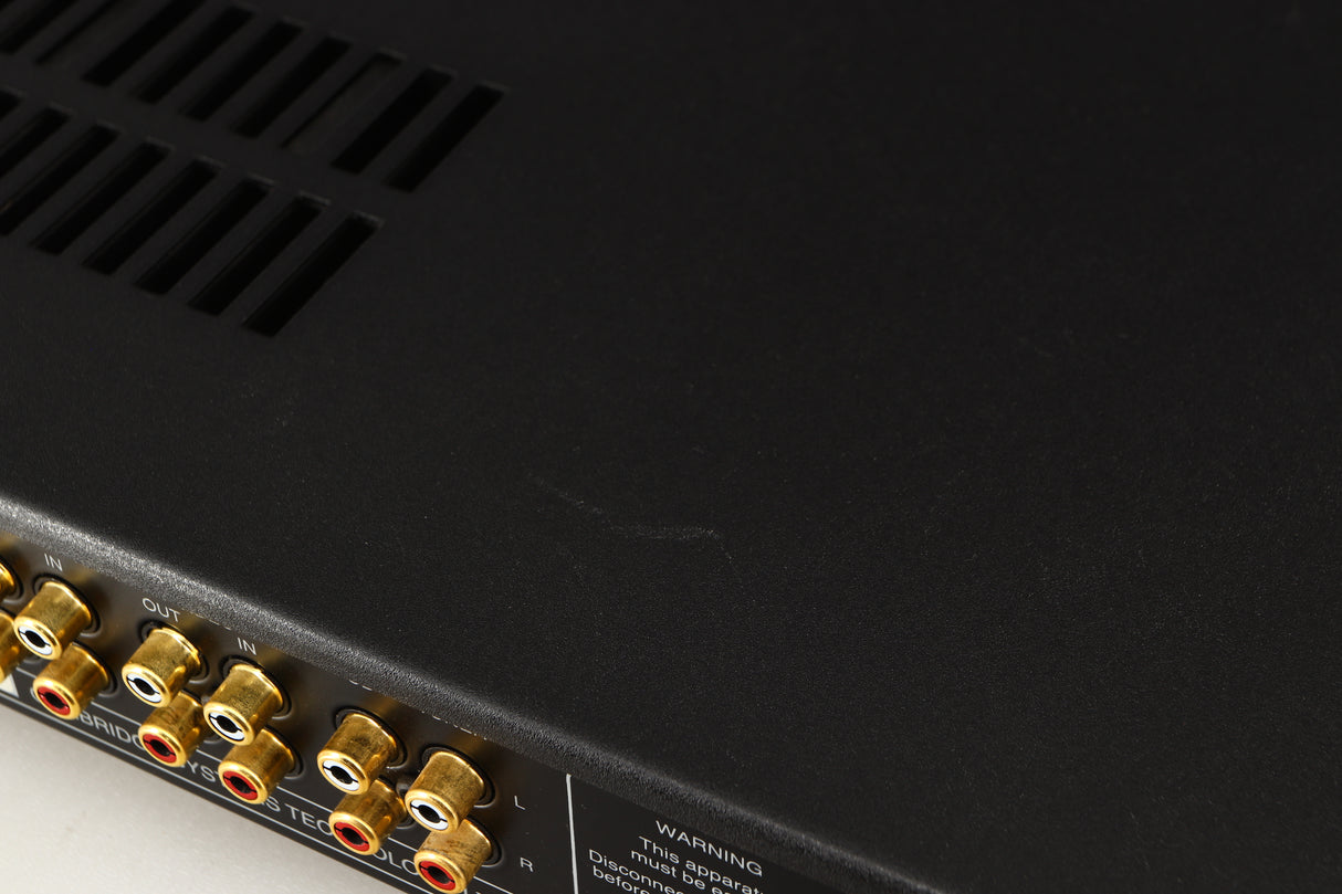 Close up of a used Audiolab 8000A Integrated Amplifier in a black finish showing scratching on top