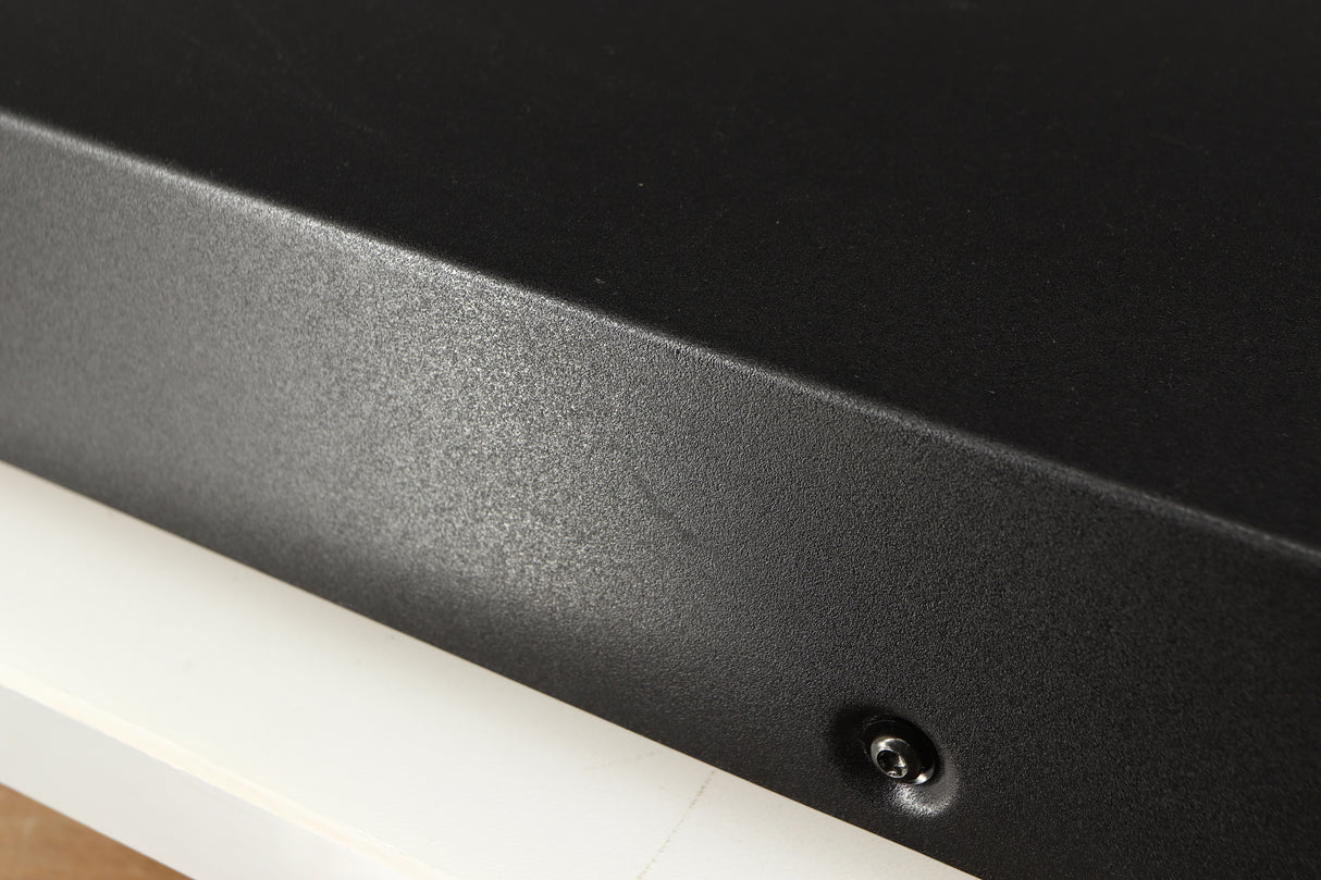 Close up of a used Audiolab 8000A Integrated Amplifier in a black finish showing scratch on left side