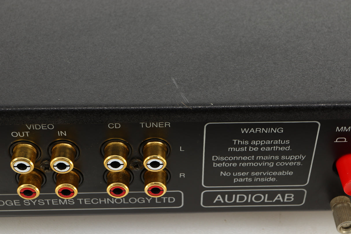 Close up view of a used Audiolab 8000C Pre Amplifier in Black finish showing scratching on the top