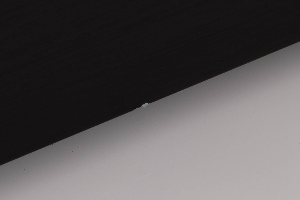 Close up of a used Audiolab 8000P Power Amplifier in a Black finish showing small blemish on front panel