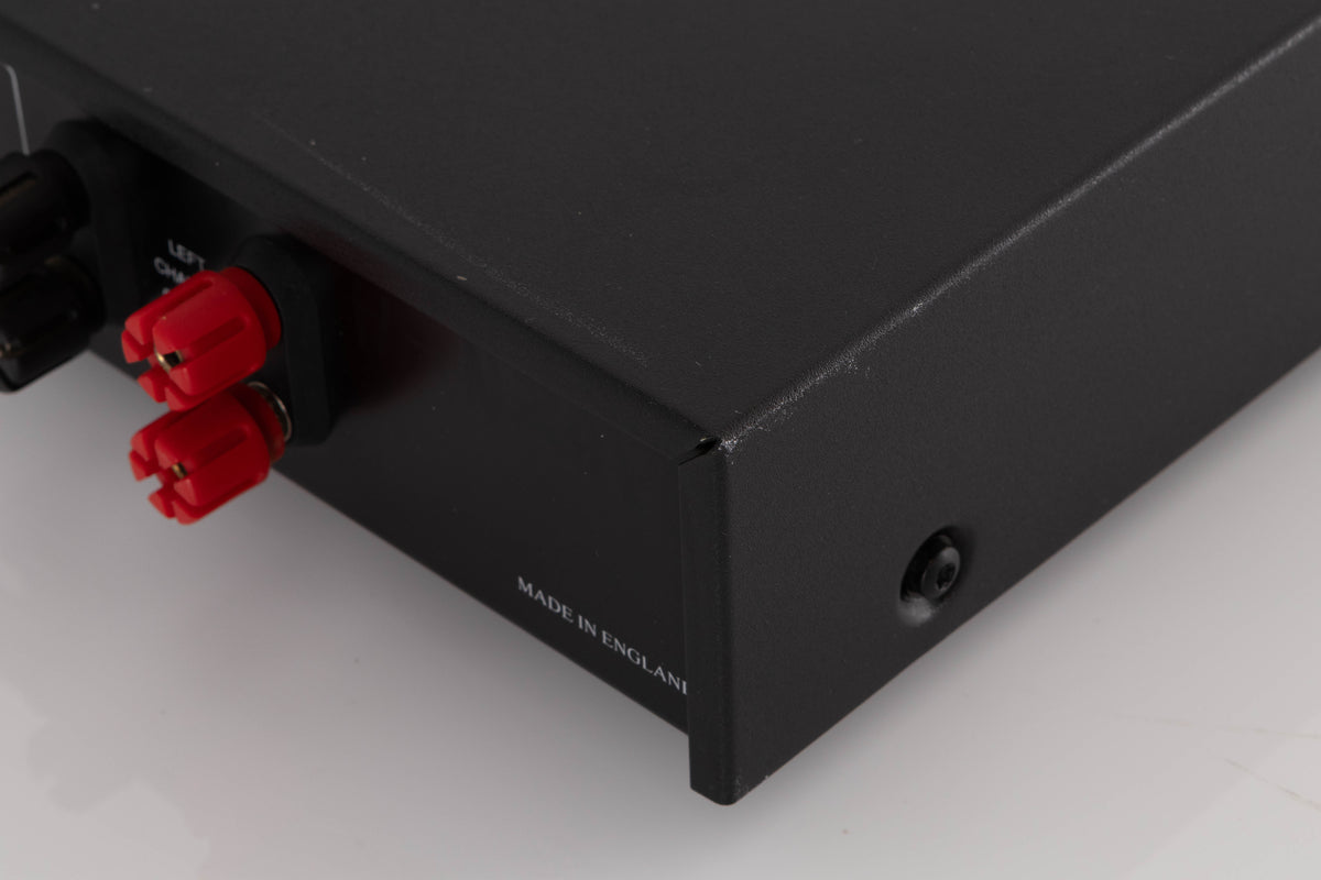 Rear left corner of a used Audiolab 8000P Power Amplifier in a Black finish