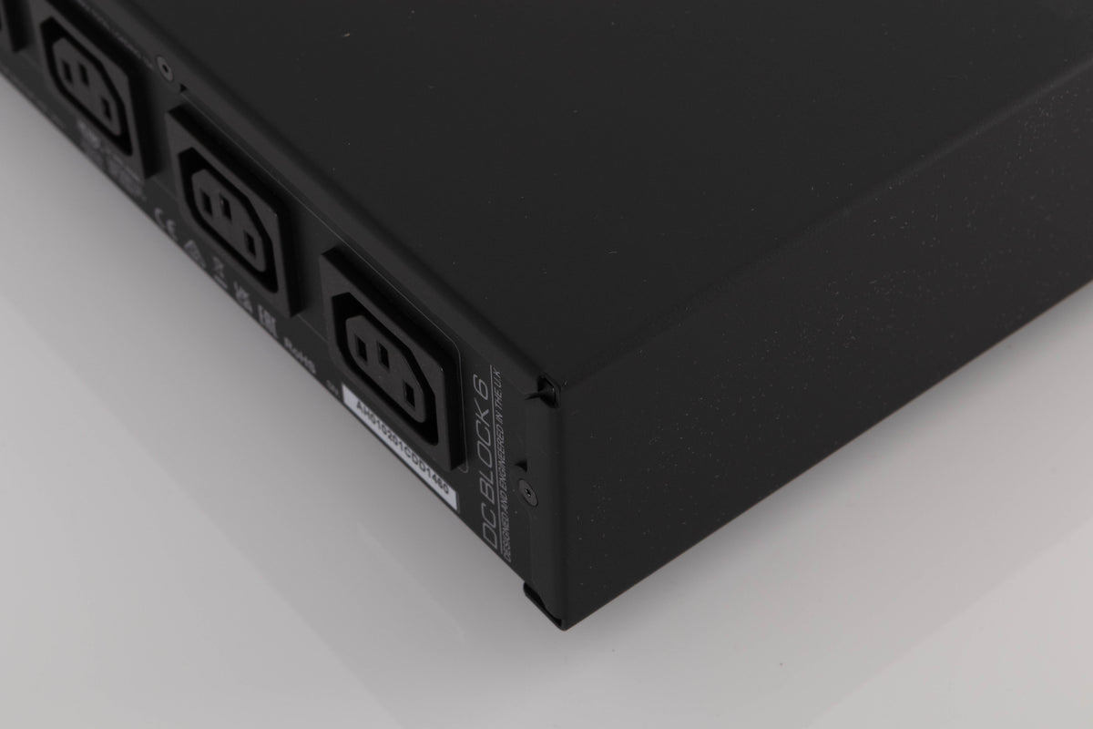 Rear left corner of a used Audiolab DC Block 6 in a Black finish