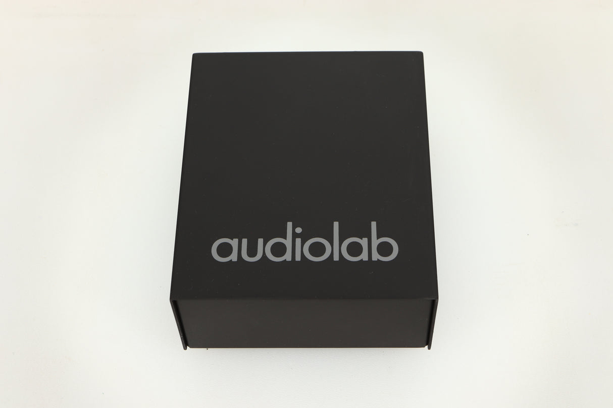 Top view of a used Audiolab DC Block Mains Filter in Black finish