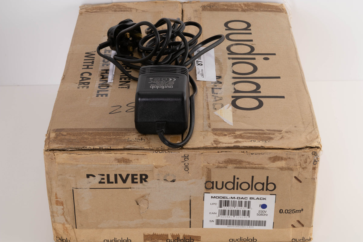 Box for a used Audiolab M-DAC Digital Analogue Converter in a Black finish showing PSU