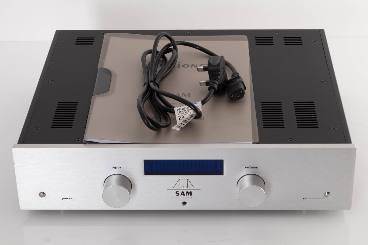 Top of a used Audionet SAM Integrated Amplifier in a Silver finish showing Mains Cable and Manual