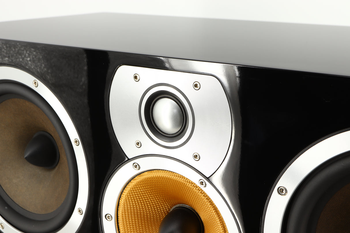 Close up of a used B&W CM Centre 2 Centre Speaker in a black gloss finish showing scratching on metal surround on tweeter