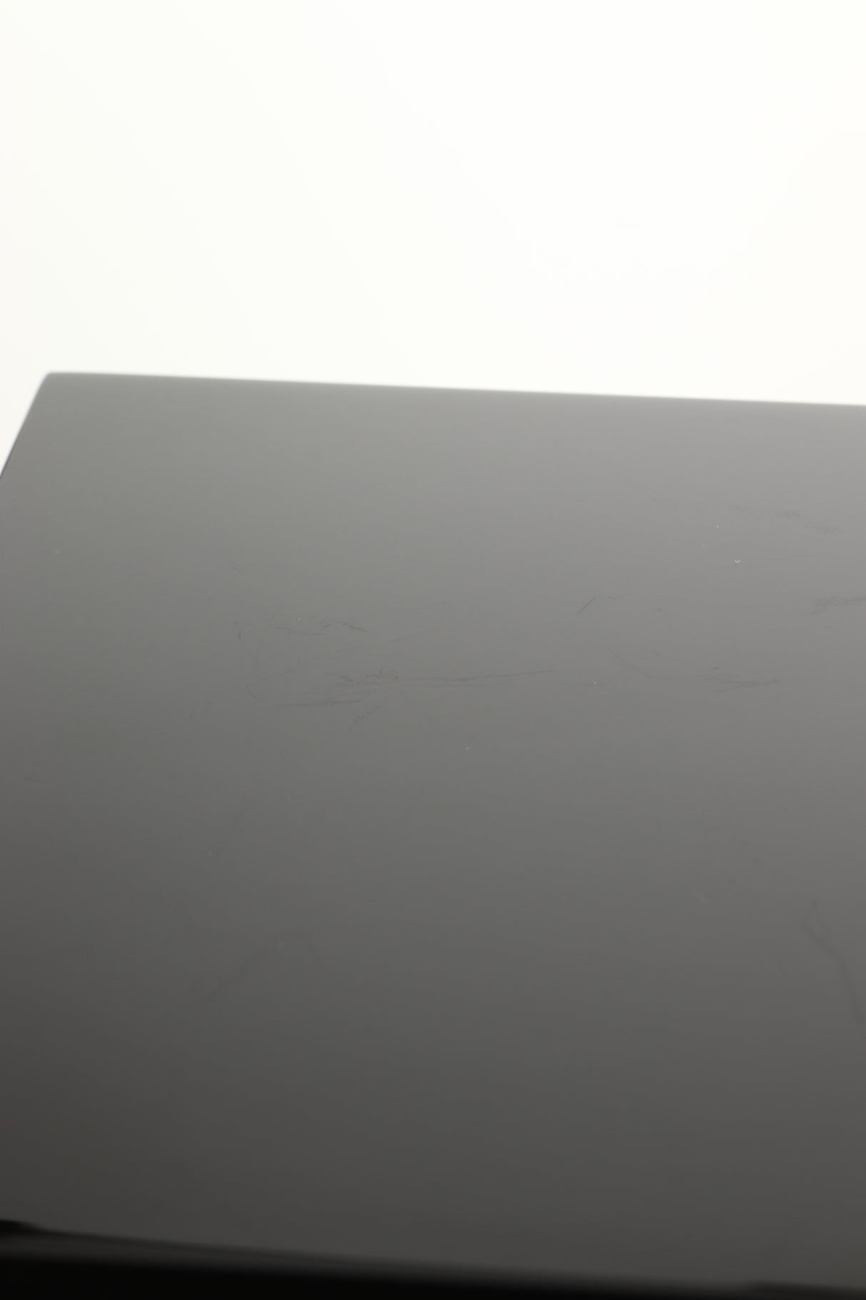 Close up view of a used B&W CM1 Standmount Speaker in Gloss Black finish showing some scratching