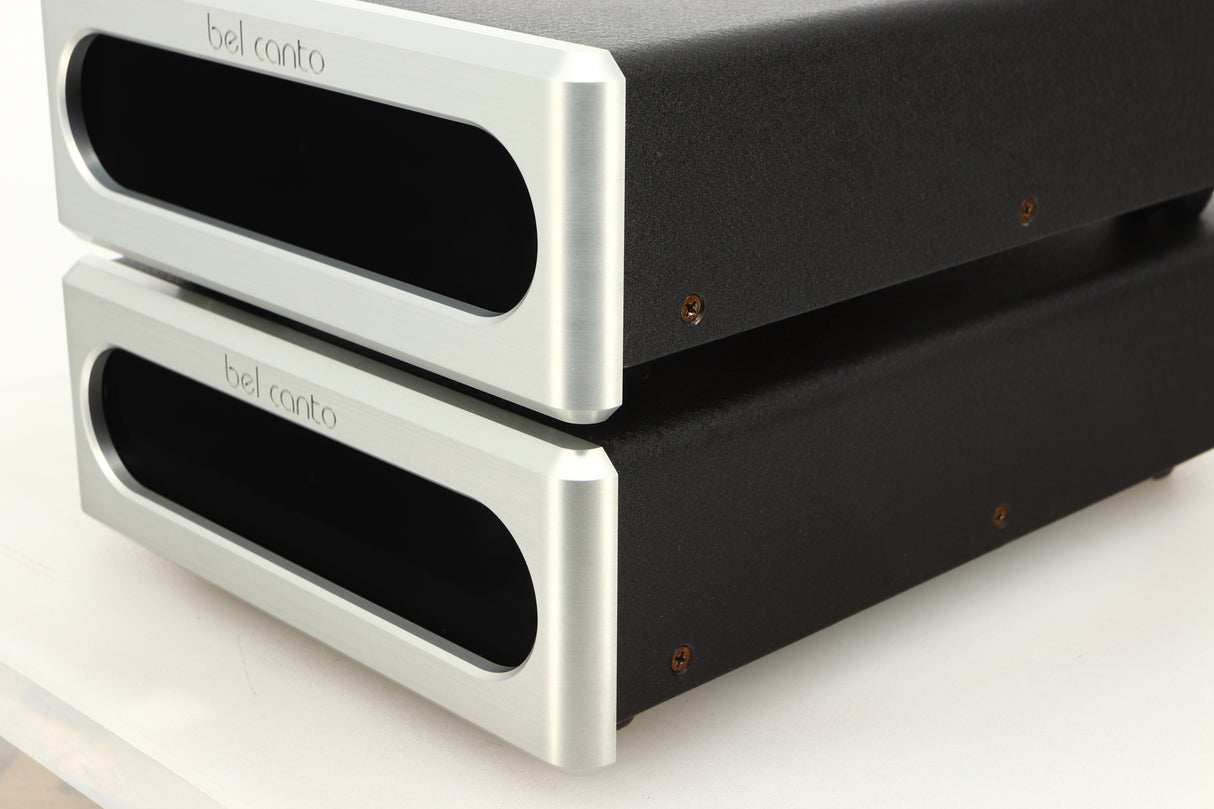 Front right corner view of a used pair of Bel Canto REF600M Monoblock Power Amplifiers in Silver finish