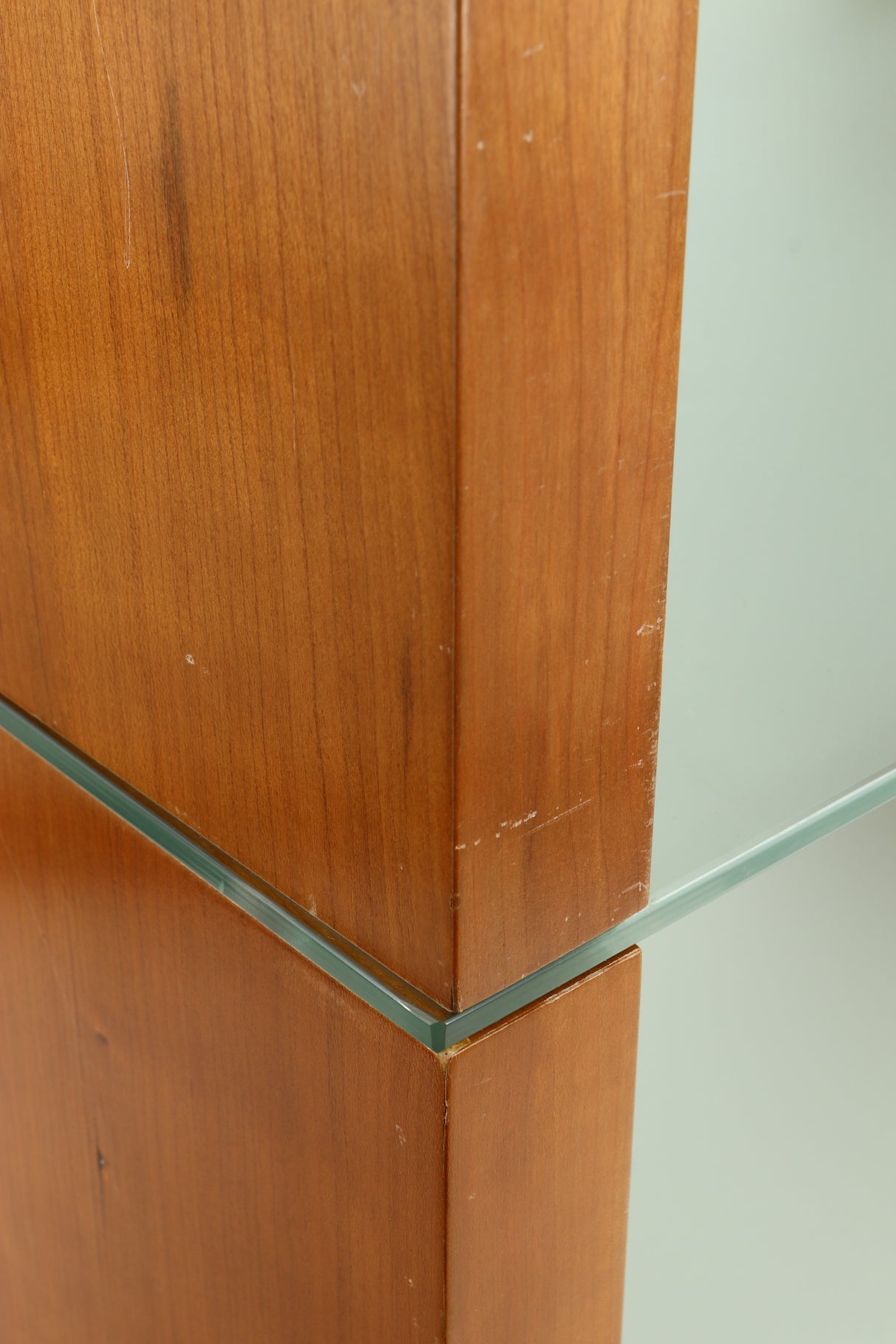 Close up of a used BLOK Hifi Stand Shelf 3 in a cherry finish showing some scratches