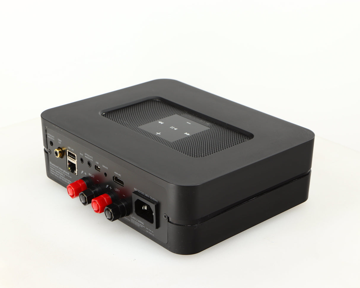 Rear left corner of a used Bluesound Powernode 2i Streaming Amplifier in a black finish