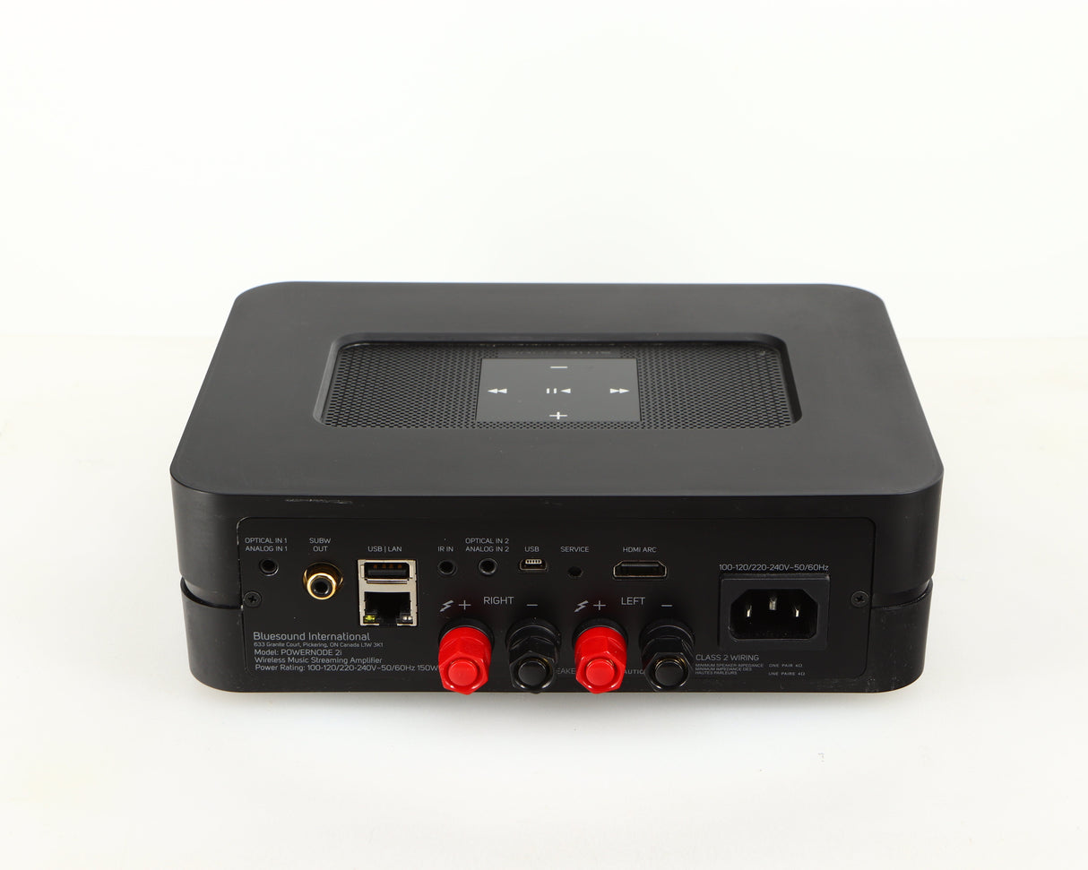 Rear view of a used Bluesound Powernode 2i Streaming Amplifier in a black finish showing Mains Input, Ethernet Input, Phono Output, Speaker Outputs and HDMI Output