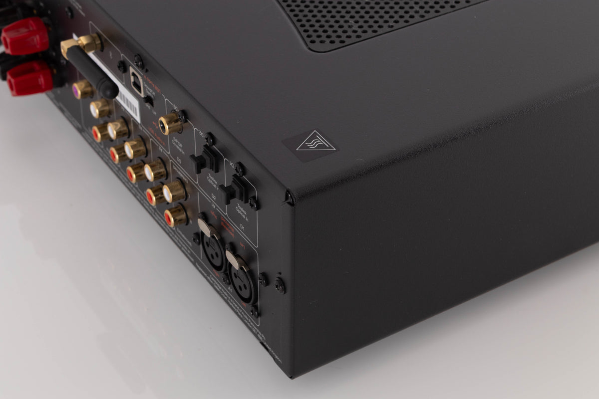 Rear left corner of a used Cambridge Audio CXA81 Integrated Amplifier in a Lunar Grey finish