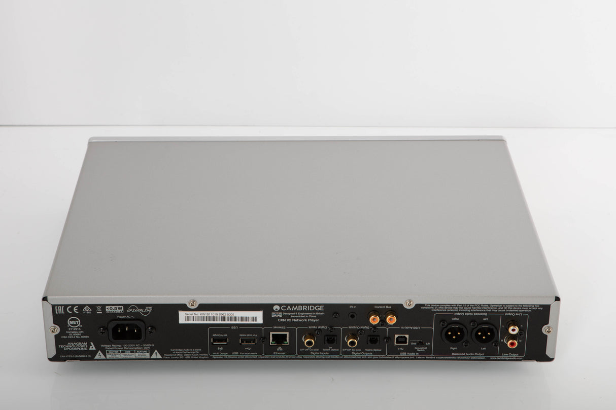Rear view of a used Cambridge Audio CXN V2 Streamer in a silver finish showing Mains Input, Phono Inputs, Phono Outputs, USB Inputs, Optical Input, Optical Output, Network Input and XLR Output