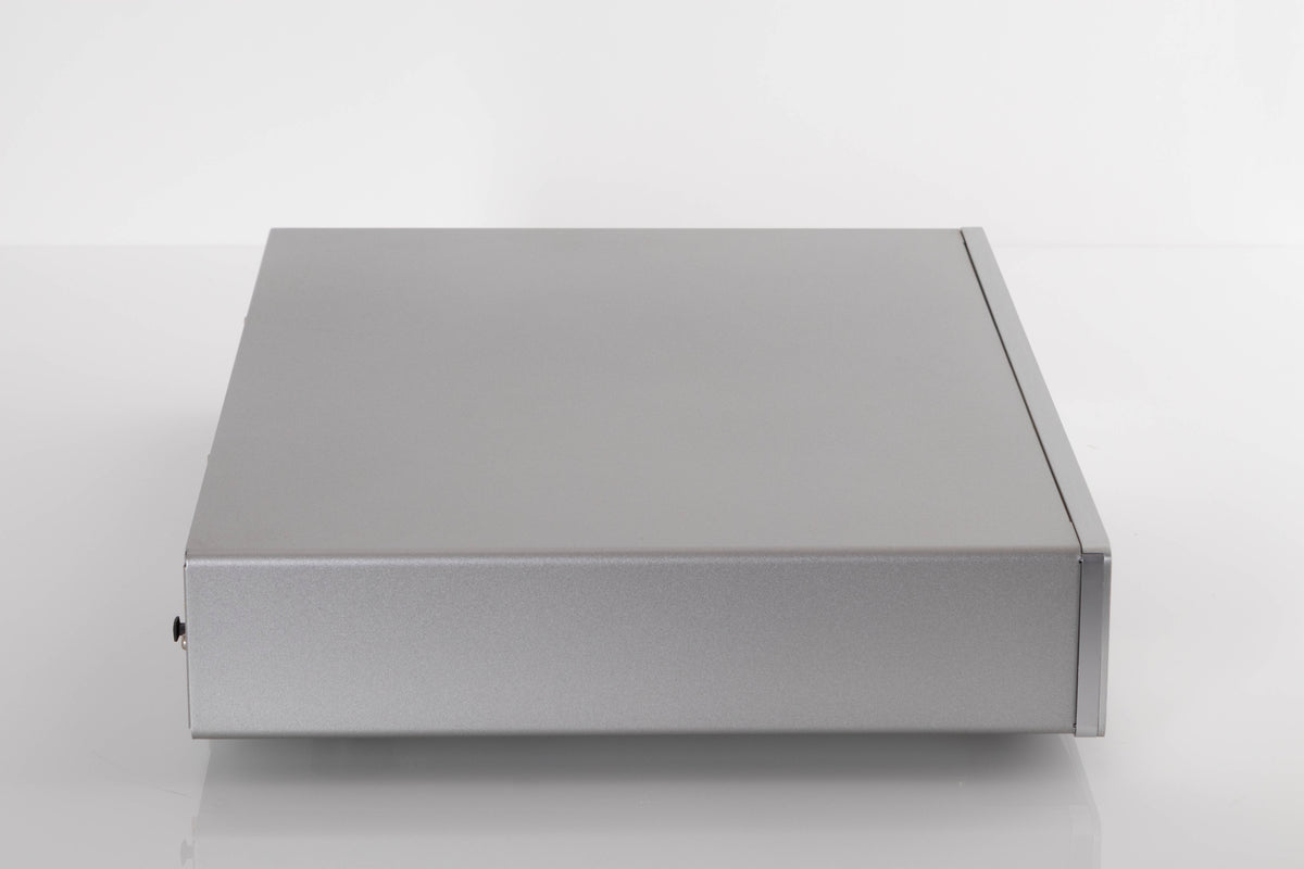 Side view of a used Cambridge CXC CD Transport in Silver