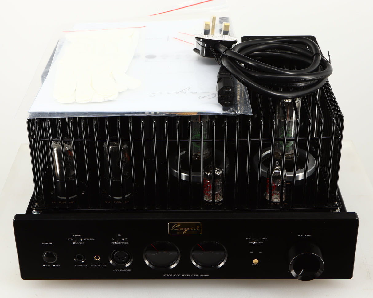 Top of a used Cayin HA-6A Headphone Amplifier in a black finish showing Manual, Mains Cable, 2x Gloves and 4x Spare Fuses